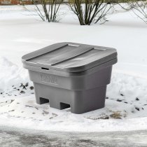 Grå sandbehållare vid vinterväd